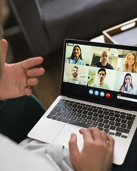 Man in video call on their laptop